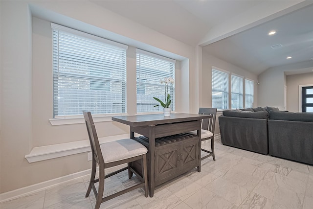 24227 Tallgrass Meadow Trl, Katy, TX 77493 - dining area with light marble finish flooring, healthy amount of natural light, recessed lighting, baseboards, and lofted ceiling