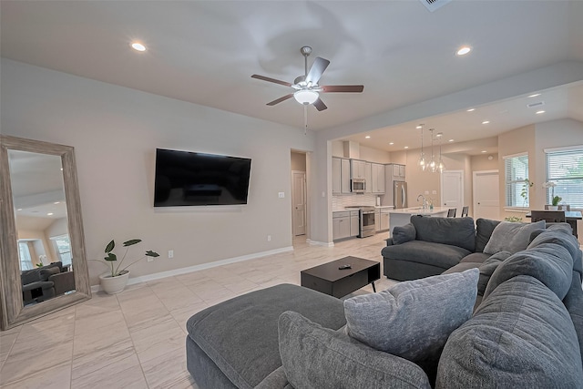 24227 Tallgrass Meadow Trl, Katy, TX 77493 - living area featuring ceiling fan, recessed lighting, baseboards, light tile patterned flooring, and a chandelier