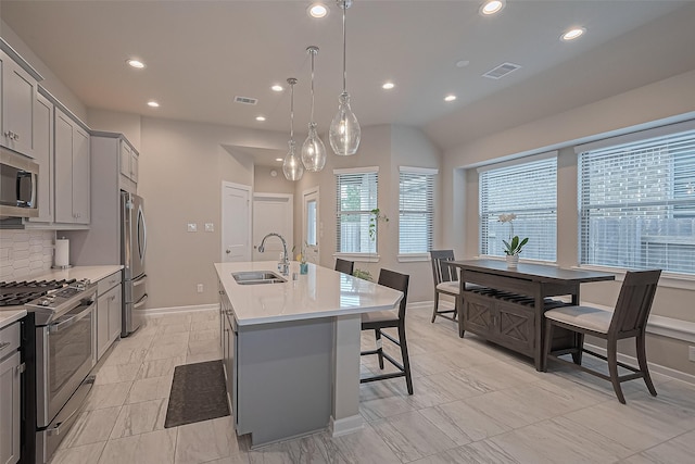 24227 Tallgrass Meadow Trl, Katy, TX 77493 - kitchen featuring a sink, gray cabinetry, appliances with stainless steel finishes, recessed lighting, and a kitchen island with sink