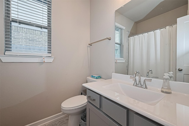 24227 Tallgrass Meadow Trl, Katy, TX 77493 - bathroom featuring toilet, vanity, and baseboards