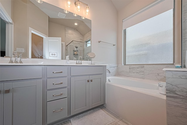 24227 Tallgrass Meadow Trl, Katy, TX 77493 - full bathroom with double vanity, a garden tub, and a stall shower