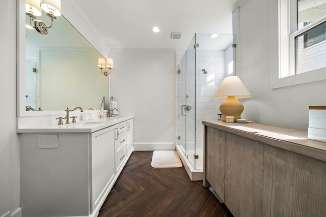 714 Merrill St, Houston, TX 77009 - bathroom featuring ornamental molding, double vanity, a stall shower, recessed lighting, and baseboards