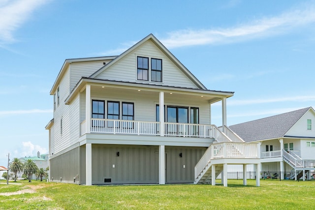 714 Vista Bella, Galveston, TX 77554 - back of property featuring stairs, board and batten siding, and a yard