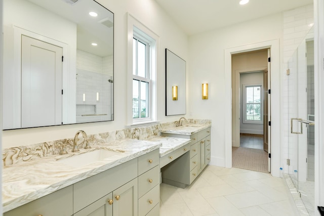 714 Vista Bella, Galveston, TX 77554 - bathroom with double vanity, a stall shower, recessed lighting, and baseboards