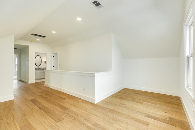 714 Vista Bella, Galveston, TX 77554 - bonus room featuring lofted ceiling, light wood-style floors, baseboards, and recessed lighting