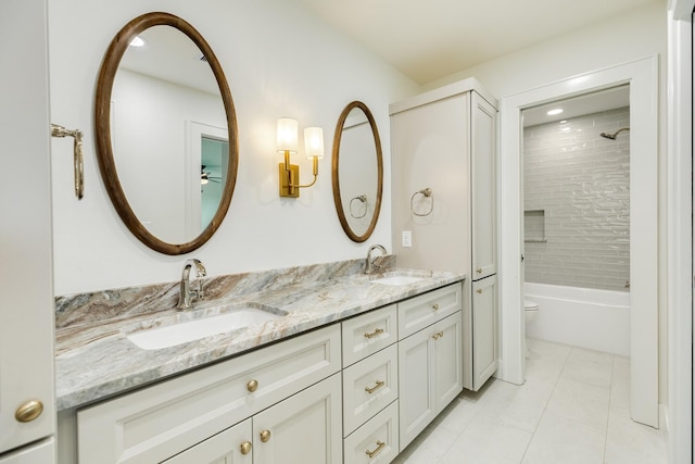 714 Vista Bella, Galveston, TX 77554 - bathroom featuring double vanity, toilet, tile patterned floors, shower / bathtub combination, and ceiling fan