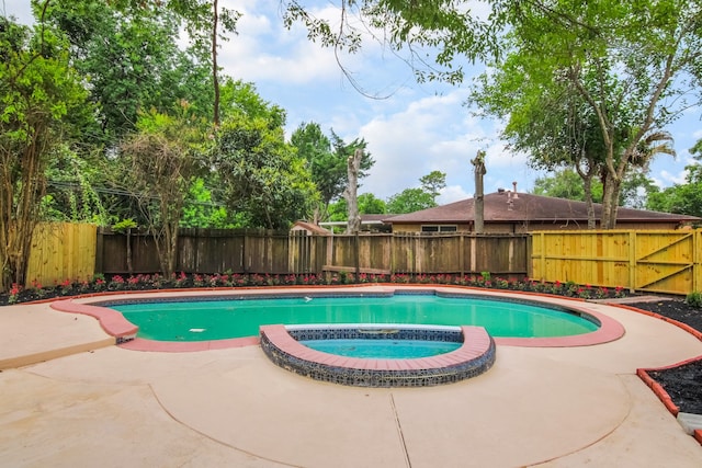 11835 S Ridgewood Cir, Houston, TX 77071 - view of swimming pool featuring a fenced backyard, a patio area, and a pool with connected hot tub