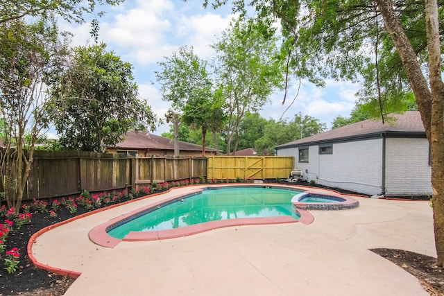 11835 S Ridgewood Cir, Houston, TX 77071 - view of pool with a patio, a fenced backyard, and a pool with connected hot tub