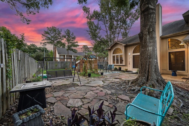 16418 Willowpark Dr, Tomball, TX 77377 - patio terrace at dusk with a patio area