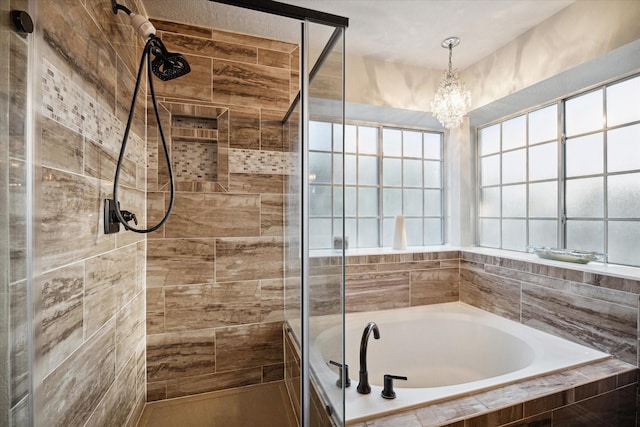 16418 Willowpark Dr, Tomball, TX 77377 - full bath with a bath, tiled shower, and a chandelier