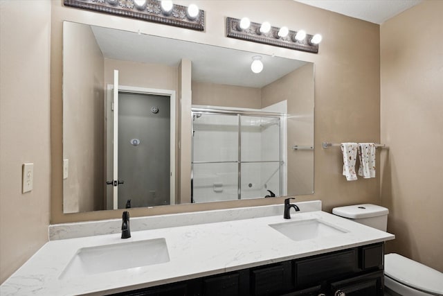 16418 Willowpark Dr, Tomball, TX 77377 - bathroom with toilet, double vanity, and a shower with door