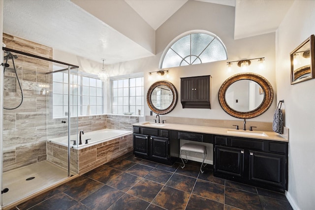 16418 Willowpark Dr, Tomball, TX 77377 - full bathroom with a garden tub, double vanity, a stall shower, and lofted ceiling