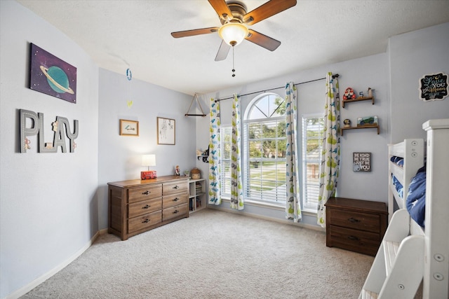 16418 Willowpark Dr, Tomball, TX 77377 - bedroom with carpet floors, baseboards, and ceiling fan