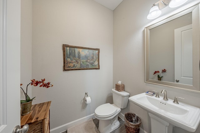 30411 Indigo Falls Dr, Brookshire, TX 77423 - bathroom with toilet, a sink, and baseboards