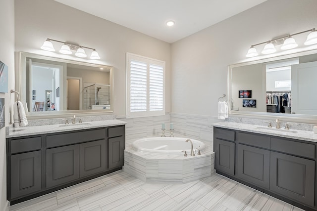 30411 Indigo Falls Dr, Brookshire, TX 77423 - bathroom featuring a stall shower, two vanities, a bath, and tile patterned flooring