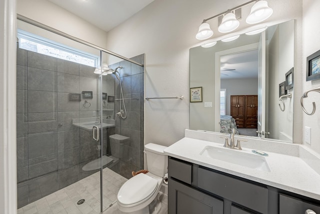 30411 Indigo Falls Dr, Brookshire, TX 77423 - ensuite bathroom featuring toilet, a shower stall, vanity, and a ceiling fan
