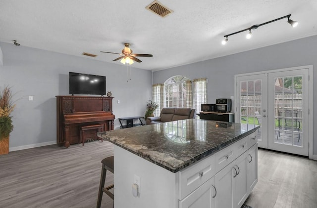 5418 Forest Springs Dr, Houston, TX 77339 - kitchen featuring plenty of natural light, light wood-style floors, and french doors