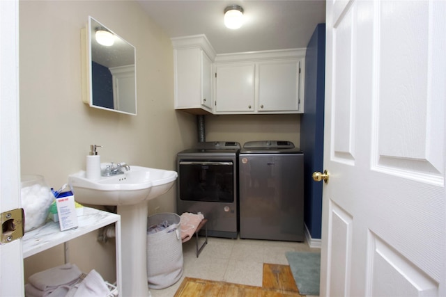 4604 Octavia St, Houston, TX 77026 - washroom with cabinet space and separate washer and dryer