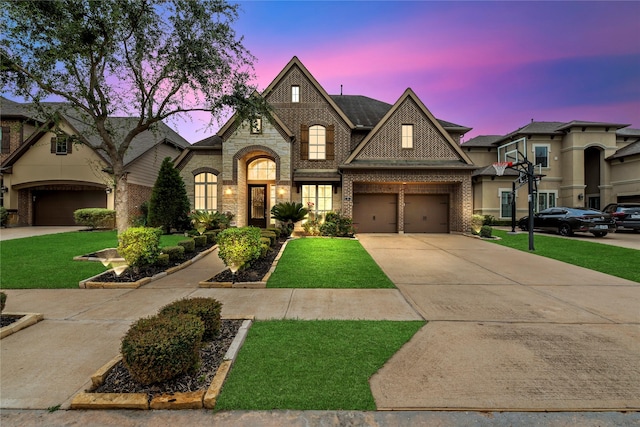 6 Volerran Path Ln, Missouri City, TX 77459 - french country home featuring brick siding, driveway, and a lawn