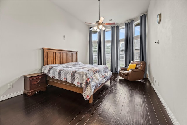 6 Volerran Path Ln, Missouri City, TX 77459 - bedroom with dark wood-style flooring, baseboards, and a ceiling fan