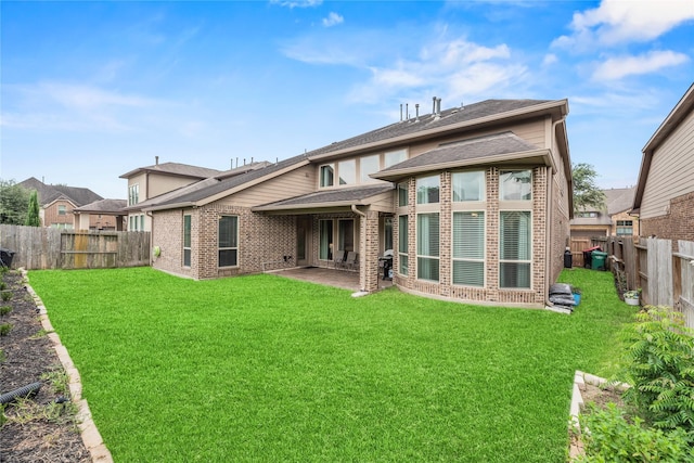 6 Volerran Path Ln, Missouri City, TX 77459 - back of house with brick siding and a patio area