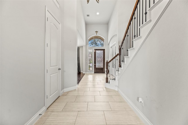 6 Volerran Path Ln, Missouri City, TX 77459 - foyer entrance featuring a chandelier, baseboards, a towering ceiling, stairs, and recessed lighting