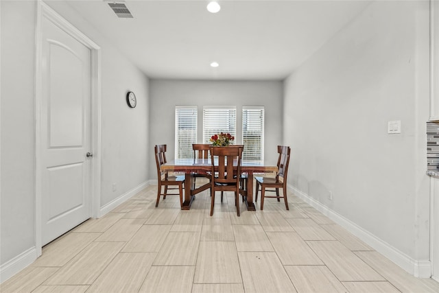 6 Volerran Path Ln, Missouri City, TX 77459 - dining room with baseboards, wood tiled floors, and recessed lighting