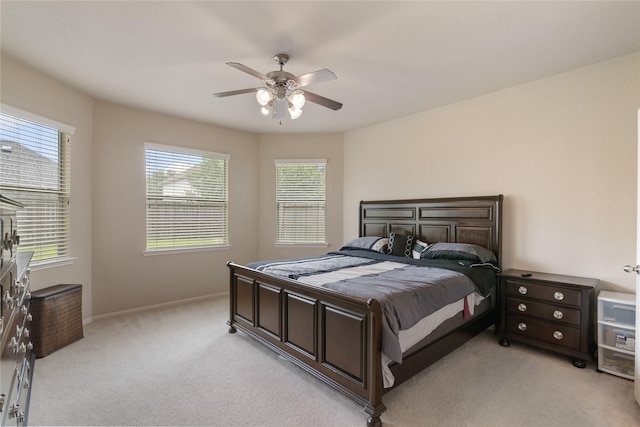 3610 Harewood Ct, Pearland, TX 77584 - bedroom with light carpet, a ceiling fan, and baseboards