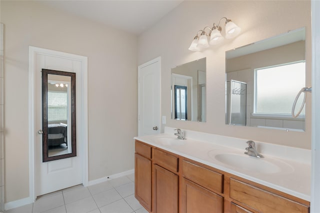 3610 Harewood Ct, Pearland, TX 77584 - full bathroom with double vanity, healthy amount of natural light, tile patterned flooring, and a shower