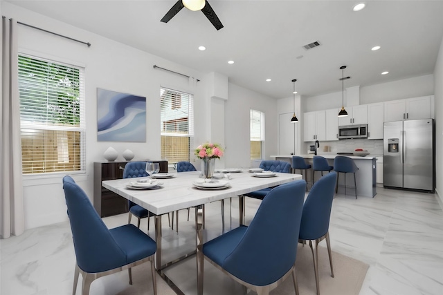 849 Mansfield St Unit F, Houston, TX 77091 - dining space featuring light marble finish flooring, recessed lighting, ceiling fan, and plenty of natural light