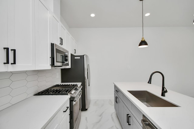 849 Mansfield St Unit F, Houston, TX 77091 - kitchen featuring stainless steel appliances, tasteful backsplash, pendant lighting, white cabinetry, and light countertops