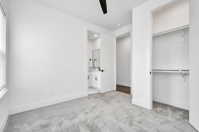 849 Mansfield St Unit F, Houston, TX 77091 - unfurnished bedroom featuring carpet flooring, a closet, connected bathroom, and ceiling fan
