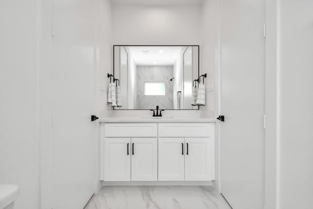 849 Mansfield St Unit F, Houston, TX 77091 - bathroom with vanity, marble look tiles, and a shower