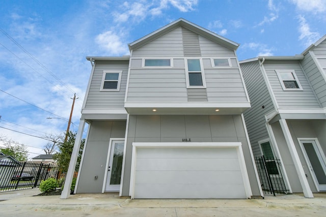 849 Mansfield St Unit F, Houston, TX 77091 - view of front of home with an attached garage and driveway
