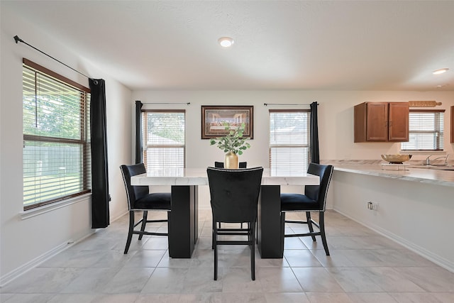 766 Hardwood Grove Ct, Houston, TX 77090 - dining room with healthy amount of natural light, baseboards, light tile patterned flooring, and recessed lighting