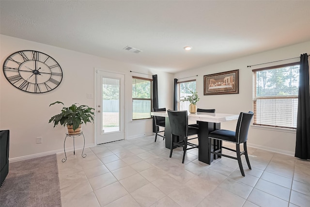 766 Hardwood Grove Ct, Houston, TX 77090 - dining room featuring plenty of natural light, baseboards, and light tile patterned floors