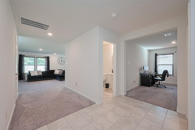766 Hardwood Grove Ct, Houston, TX 77090 - hallway with light colored carpet, an office area, light tile patterned floors, baseboards, and recessed lighting