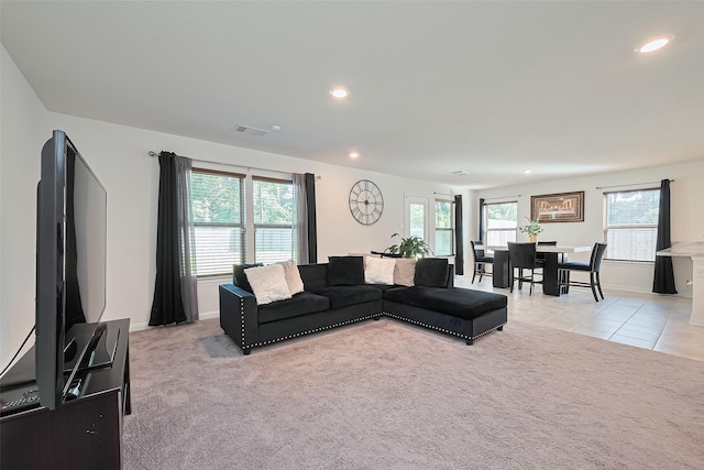 766 Hardwood Grove Ct, Houston, TX 77090 - living room with light carpet, recessed lighting, baseboards, and light tile patterned floors