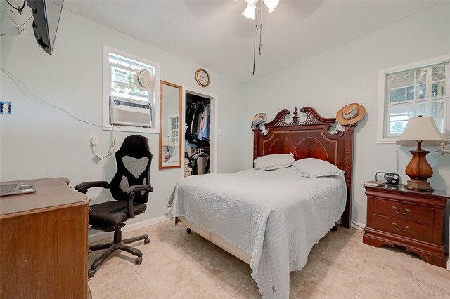 2087 Rd 5210, Cleveland, TX 77327 - bedroom featuring a spacious closet, a closet, cooling unit, ceiling fan, and light tile patterned floors