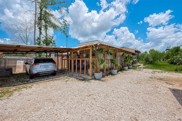 2087 Rd 5210, Cleveland, TX 77327 - view of front facade featuring a carport