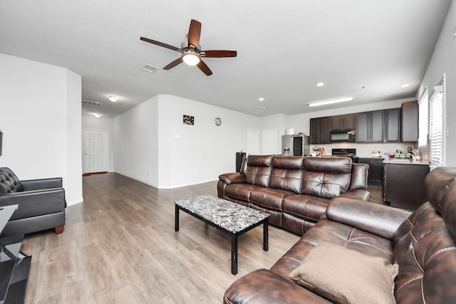 18510 Snowy River Ln, Katy, TX 77084 - living area with ceiling fan, light wood-style floors, recessed lighting, and baseboards