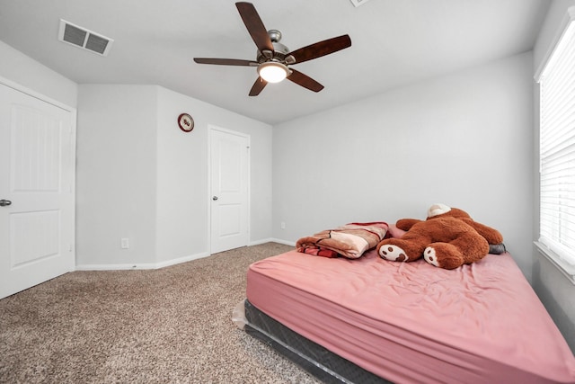18510 Snowy River Ln, Katy, TX 77084 - carpeted bedroom with baseboards, multiple windows, and a ceiling fan