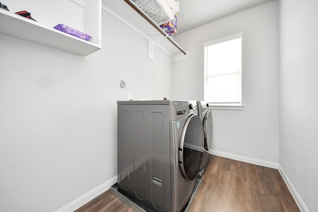 18510 Snowy River Ln, Katy, TX 77084 - washroom with separate washer and dryer, baseboards, and dark wood-type flooring