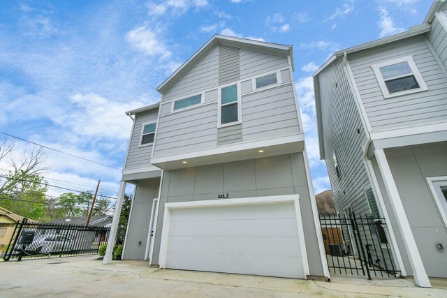 849 Mansfield St Unit A, Houston, TX 77091 - view of front of house with a garage and driveway