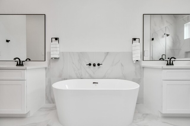 849 Mansfield St Unit A, Houston, TX 77091 - full bath featuring marble finish flooring, tile walls, two vanities, a marble finish shower, and a freestanding bath