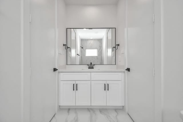 853 Mansfield St Unit F, Houston, TX 77091 - bathroom with vanity and marble look tiles