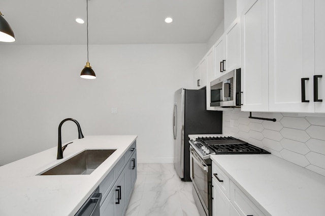 853 Mansfield St Unit F, Houston, TX 77091 - kitchen featuring appliances with stainless steel finishes, light marble finish floors, tasteful backsplash, recessed lighting, and pendant lighting