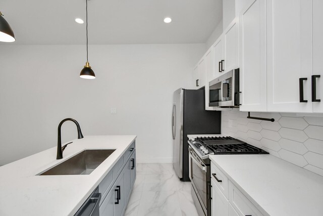 853 Mansfield St Unit D, Houston, TX 77091 - kitchen featuring appliances with stainless steel finishes, light marble finish floors, tasteful backsplash, recessed lighting, and pendant lighting