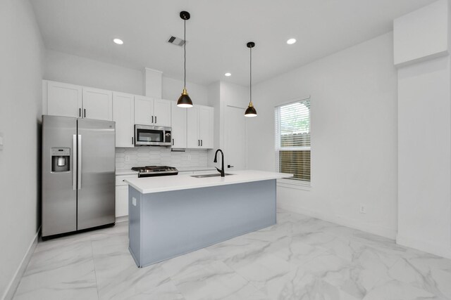 853 Mansfield St Unit D, Houston, TX 77091 - kitchen with appliances with stainless steel finishes, light marble finish floors, white cabinetry, backsplash, and recessed lighting