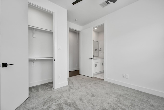 853 Mansfield St Unit D, Houston, TX 77091 - unfurnished bedroom with carpet floors, a closet, ensuite bathroom, and ceiling fan